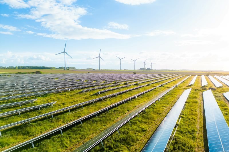 a field of solar power and wind turbines